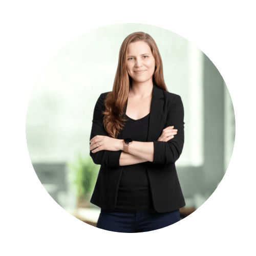 Woman standing with arms crossed.